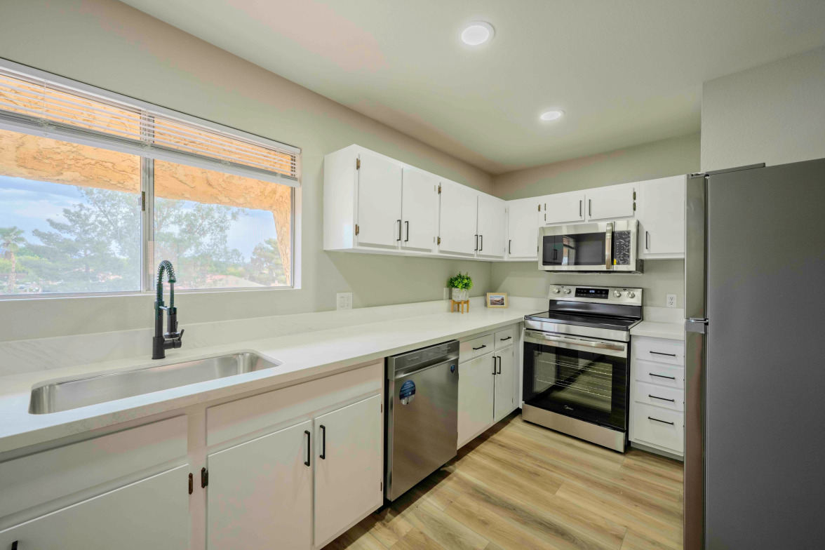 Updated kitchen with renovated cabinets, hardware, fixtures, and canned lighting — 1303 Darlene Way Unit 301C, Boulder City, NV